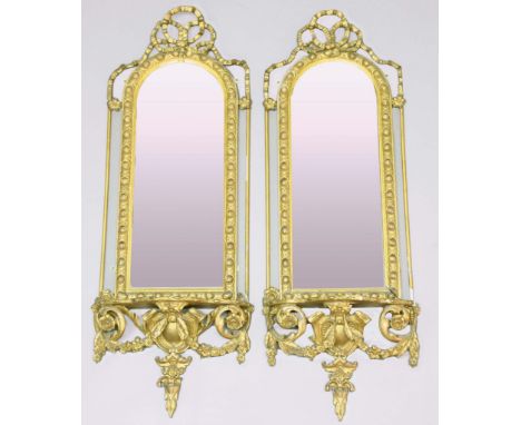 PAIR OF VICTORIAN GILT GESSO PIER MIRRORS,  the arching plate beneath a ribbon bow crest and above a serpentine shelf with fo