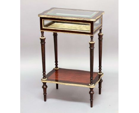 FRENCH MAHOGANY AND GILT METAL MOUNTED BIJOUTERIE CABINET, circa 1900, the shaped rectangular cover with bevelled glass enclo