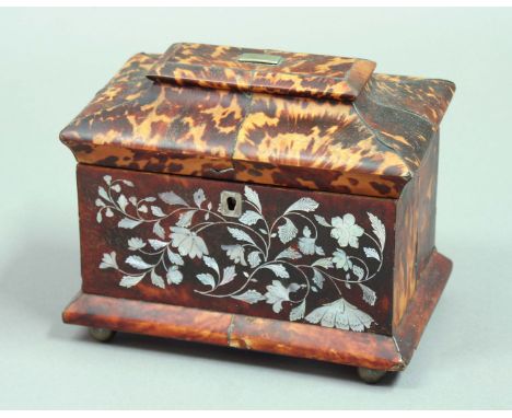 TORTOISESHELL TEA CADDY of sarcophagus form, mid-19th century, with scrolling mother-of-pearl inlay, the interior with two li