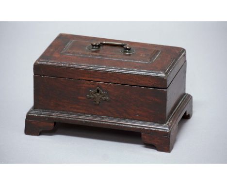 OAK TEA CADDY, mid 18th century, the hinged cover enclosing a three section interior, height 16cm, width 28cm, depth 18cm