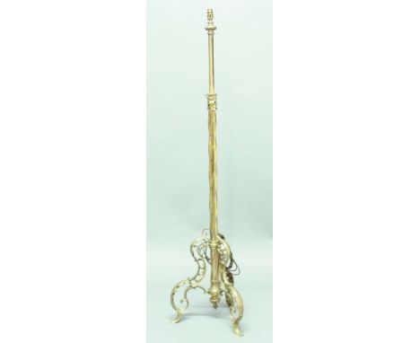 BRASS TELESCOPIC LAMP STANDARD, with twisting column and scrolling tripod base, height excluding fittings 140cm - 180cm