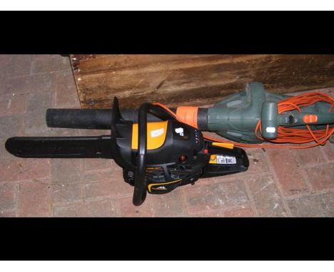 A Black &amp; Decker electric leaf blower, together with a McCulloch petrol chainsaw
