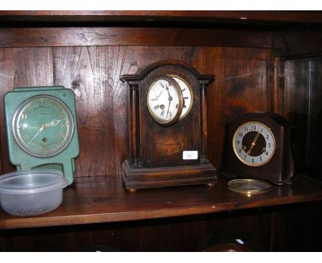 A Smiths brown Bakelite mantel clock, an Enfield green metal mantel clock, together with one other