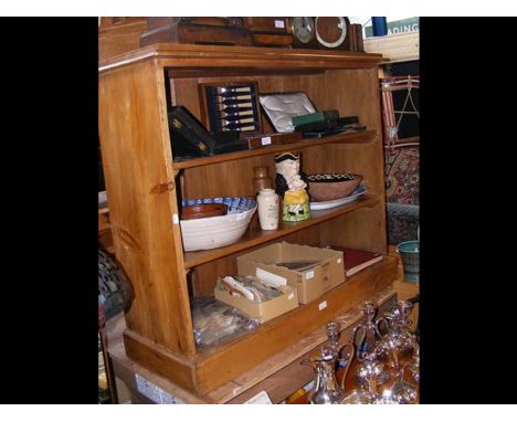 A pine two shelf open bookcase - width 110cms