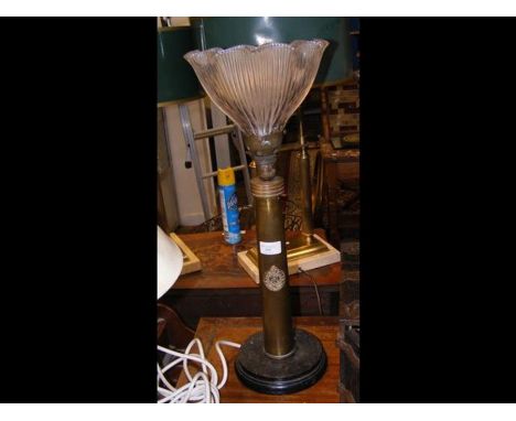 An unusual 58cm high table lamp in the form of an artillery shell, with Royal Engineer embossed plate 