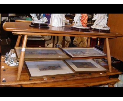 An Ercol light elm coffee table with rack under