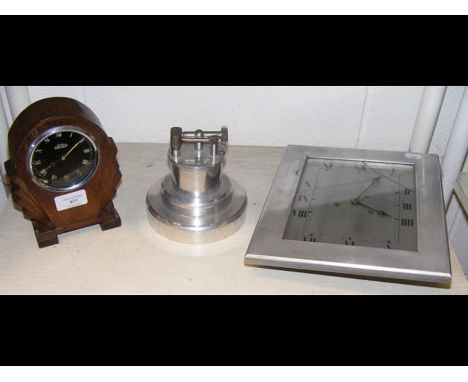 A vintage desk lighter, a Jaeger 'dashboard' clock in oak frame, together with one other clock in aluminum frame