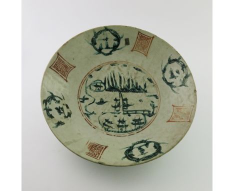 A Chinese provincial dish, the inner decorated with seals in iron red and pagoda landscapes in green enamel, diameter 38cm 
