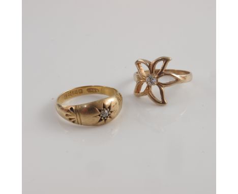 An 18ct yellow gold diamond set gypsy ring 3.3gms together with a 9ct gold diamond set openwork five petal flower form ring, 