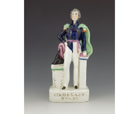 A Staffordshire figure of 'Sir De Lacy Evans', circa 1854, modelled standing beside a cocked hat on a table, his left hand re