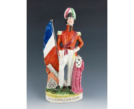 A Staffordshire figure of General Sir William John Codrington, circa 1856, modelled standing beside a cloak with a cocked can