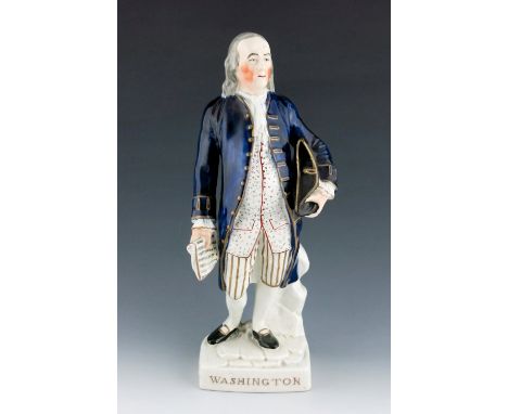 A Staffordshire figure of George Washington, circa 1855, modelled standing, holding a hat and a scroll, wearing trousers with