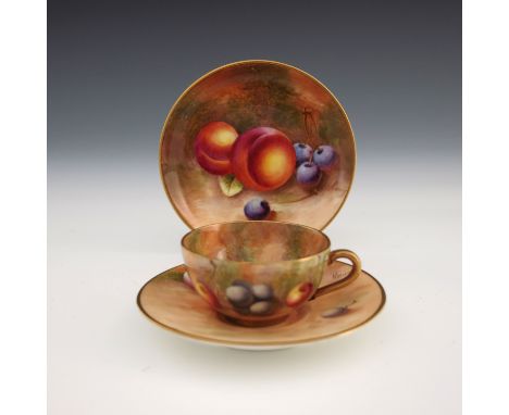 A Royal Worcester fruit painted miniature tea trio, 1952 to 1954, including cup, saucer and plate, decorated with grapes, che