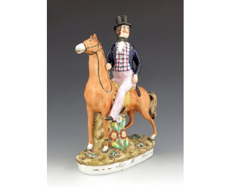 A Staffordshire figure of Robert Peel, titled 'Sir R. Peel', circa 1850, modelled on horseback, atop an oval plinth base feat