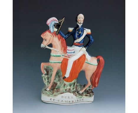 A Staffordshire equestrian figure of the 'Duke of Cambridge', circa 1860, modelled on horseback, holding a feathered hat in h