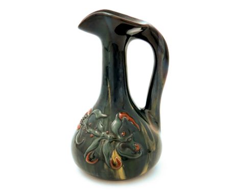 Edmund Harry Elton for Sunflower Pottery, an Elton Ware jug, bulbous bottle form, slip decorated with raised tulip design on 