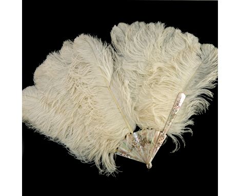 A late 19th/early 20th Century French white ostrich feather fan, mother of pearl guards and sticks with gilt and silvered flo