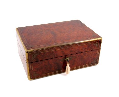 A mid 19th Century French amboyna dressing case by Louis Aucoc Aine, Paris, circa 1850, brass bound and strung with bow corne