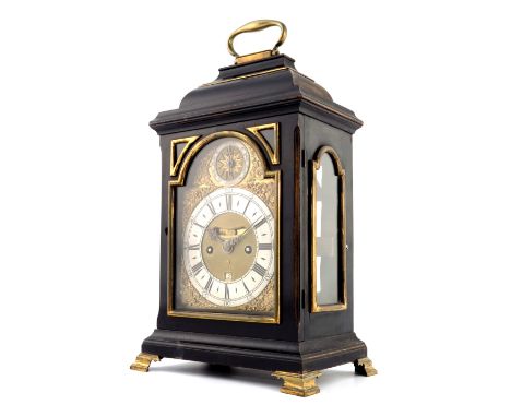 A George III ebonised bracket clock, caddy top with brass swing handle, arched brass dial with strike/silent subsidiary dial,