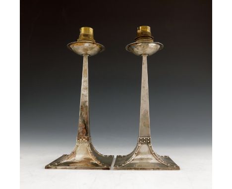 After Jan Eisenloffel, a pair of Arts and Crafts silver candlestick lamp bases, Gibson and Co., Sheffield 1908, tapered and s
