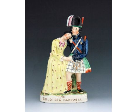 A Staffordshire figure group titled 'The Soldiers Farewell', circa 1855, modelled as a Scottish soldier wearing a blue jacket