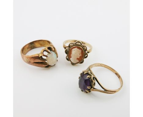 An 18ct rose gold opal gypsy set ring, 15cm internal diameter, together with two 9ct yellow gold ring, cameo and amethyst set