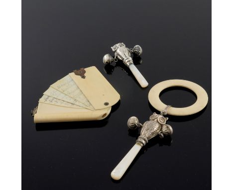 Two Elizabeth II silver and mother of pearl baby's teething rattles, Crisford and Norris, modelled as owls, one with a cellul