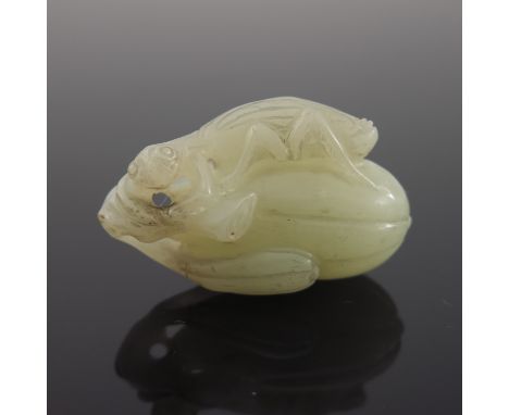 A Chinese pale jade netsuke, in the form of a gourd surmounted by a locust, 5cm wide