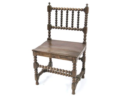 A Charles II fruitwood bobbin turned joined side chair, circa 1680 and later, upright finials, plank seat, stretchers, height