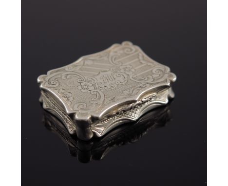 A Victorian silver vinaigrette, Nathaniel Mills, Birmingham 1845, castle top form with engine turned designs within foliate s