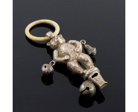 An Edwardian novelty silver baby's rattle, Crisford and Norris, Birmingham 1910, modelled as a Teddy bear, with bells and whi