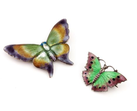 Two silver and enamelled butterfly brooches, each with basse taille purple and green enamel wings, 5cm and 3cm wide, 12.4g (2