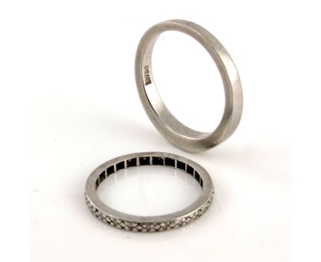 A platinum plain band, stamped 950, 1.75cm internal diameter 7.2g, together with a white metal and gem set eternity ring, 2g 