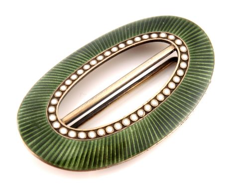 Marius Hammer, a Norwegian silver gilt and enamelled buckle, oval form, green enamel ribbed band with white beaded border, 6.