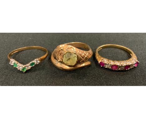 A  pale yellow stone and gold coloured metal snake ring, stamped 9 g gold, 2.8g gross;  9ct gold ruby and diamond accented ri