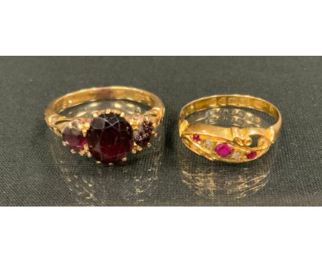 A 19th century garnet ring, 18ct gold shank, stamped 18, size R, 5.1g gross;  an 18ct gold ruby and rose cut diamond ring, Ch