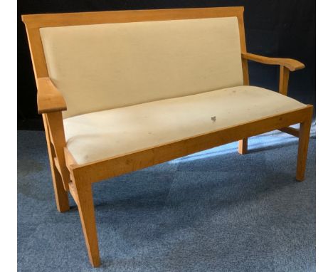 A 20th century light oak settle, upholstered seat and back, 128cm wide x 52cm depth x 87cm tall. (note - this item is sold fo