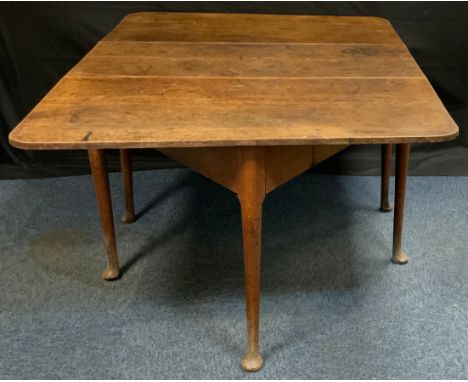 An early 19th century oak gate-leg dining table, rounded rectangular top, 112cm x 48cm  (112cm x 154cm when leaves extended) 