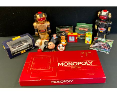 Toys - a Magic Mike II robot in black;  another gold;  Deluxe Monopoly;  Maisto Jaguar XJ220 car;  Disney Mickey Mouse jack i