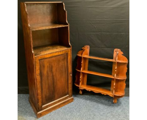 A mid 20th century oak waterfall bookcase cupboard, 139cm tall x 50cm wide x 34cm depth, c.1950;  a mahogany wall shelf, (2).