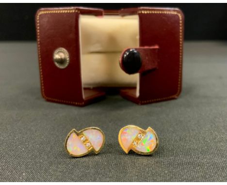 A pair of opal and diamond earrings, two arched opal panels divided by pair of round brilliant cut diamond accents, 18ct gold