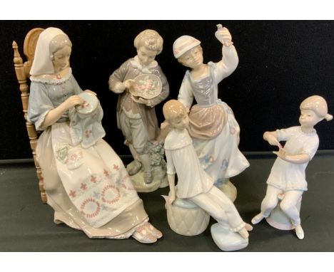 Ceramic figures- Lladro figures; a women figure sat embroidering, a pair of child figures, a gentleman figure; other (5) 
