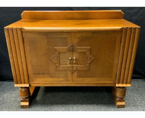 An Art Deco light oak two door sideboard, fitted interior, 90cm high, 122cm wide, 50cm deep. 