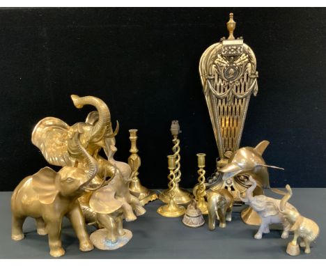 A large brass model as a seated elephant;  others smaller walking, rearing etc;  Dolphin;  candle lamp etc 