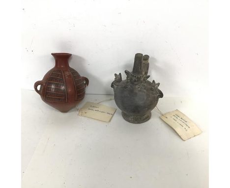 A chimu bottle, with label stating possibly Lambayeque (h.18cm x 14cm) and another two handled vessel with tag stating, possi