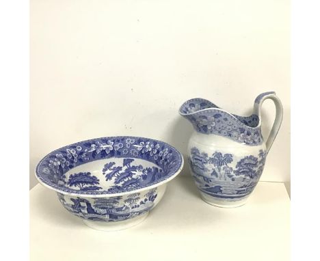 A 19thc. Copeland transfer printed wash basin and ewer, decorated with floral borders with a central design of a rural landsc