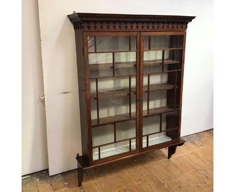 A Regency good quality mahogany decorative bookcase top, converted to a hanging shelf, the projecting cornice and arched frie