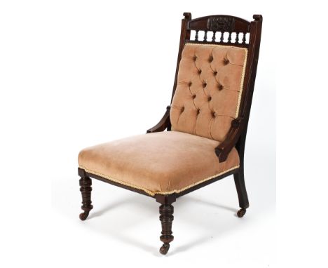 A Victorian nursing chair, with a button back, stuffed over seat and turned front legs, height 96cm