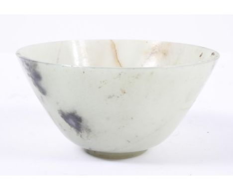 A Chinese pale celadon 'jade' bowl, of conical form with a narrow foot, 12.5cm diameter