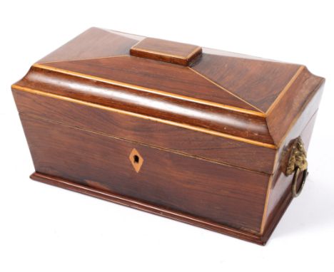 A Victorian rosewood sarcophagus shaped ballot box or converted tea caddy, with boxwood line inlay and red leather lined cove